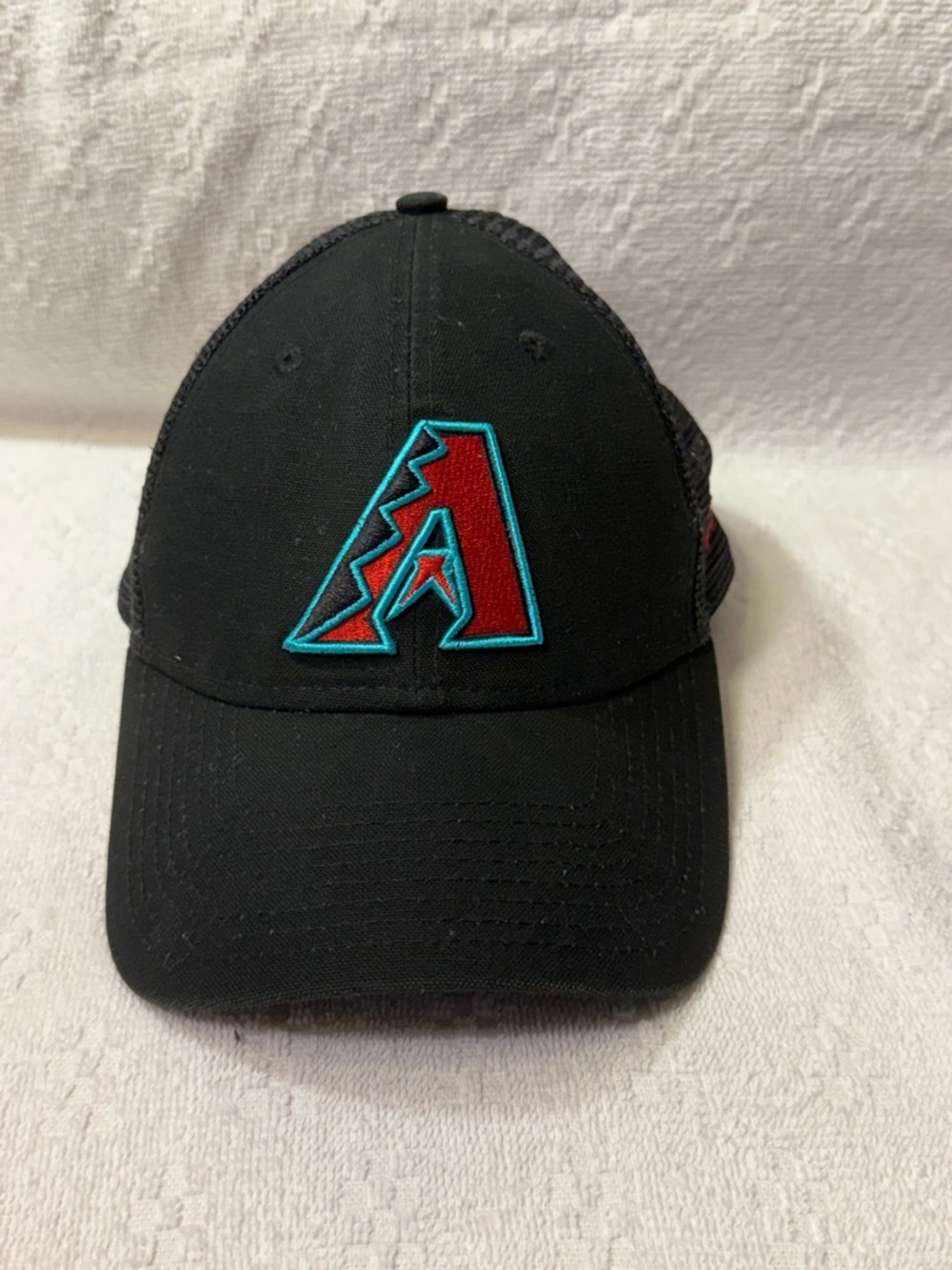 New Era Black Trucker Hat with Red & Blue Patch